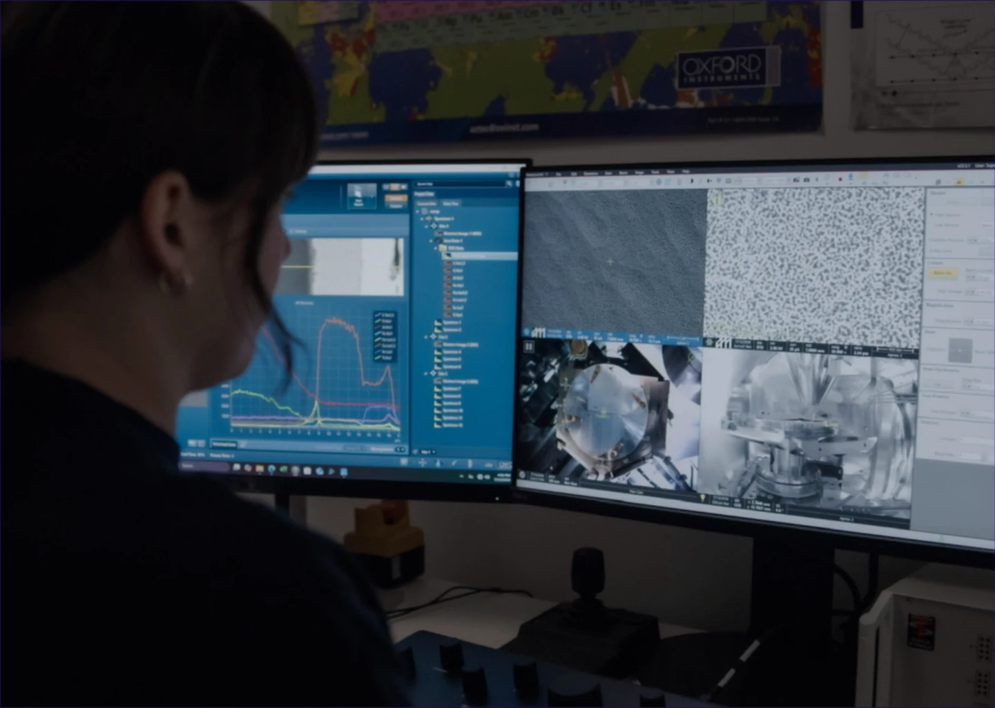 A person seated at a workstation viewing microscope images and analysis software on two monitors