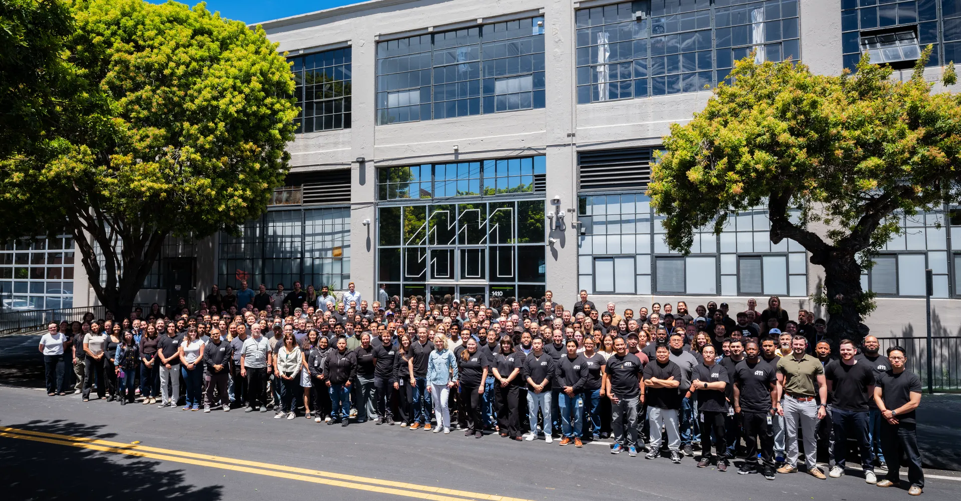 The Atomic Machines team gathered in front of the Emeryville headquarters